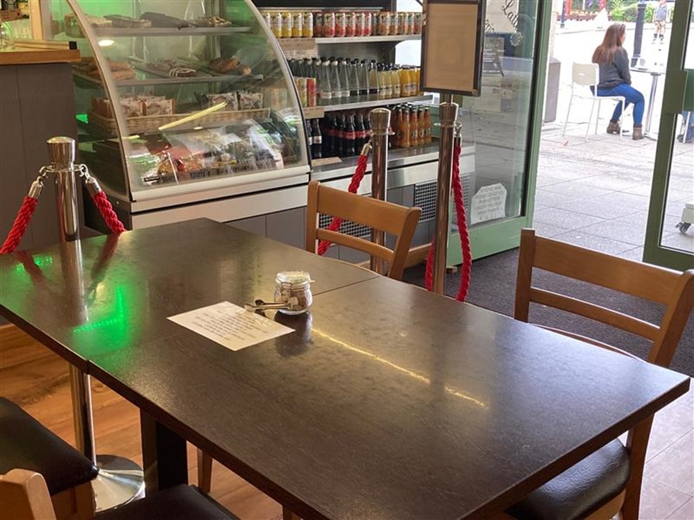 Greens Coffee & Company Ltd, seating area and food display cabinet