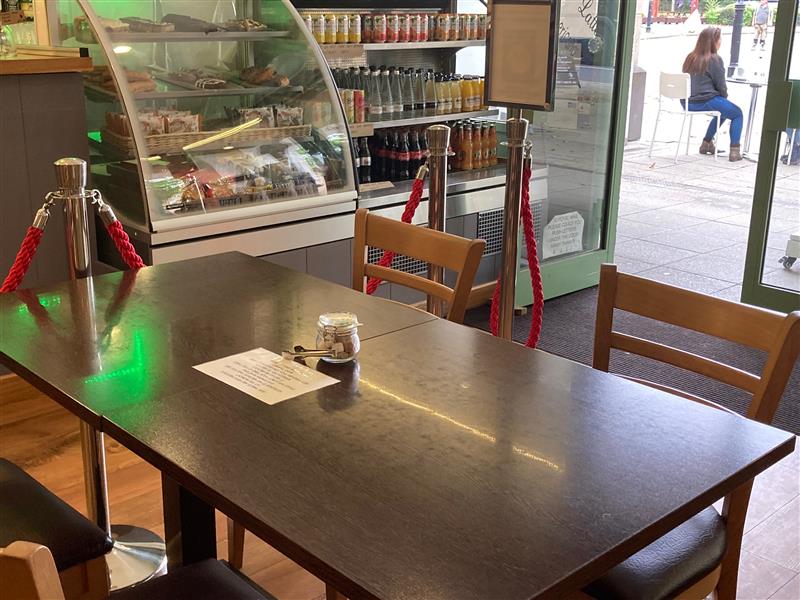 Greens Coffee & Company Ltd, seating area and food display cabinet