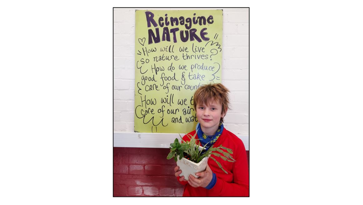  Swavesey Sustainability Day - boy with plant