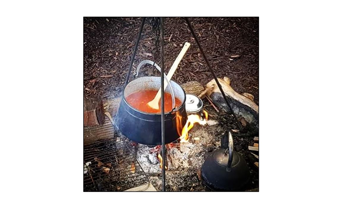 Wildly Curious - pot over fire