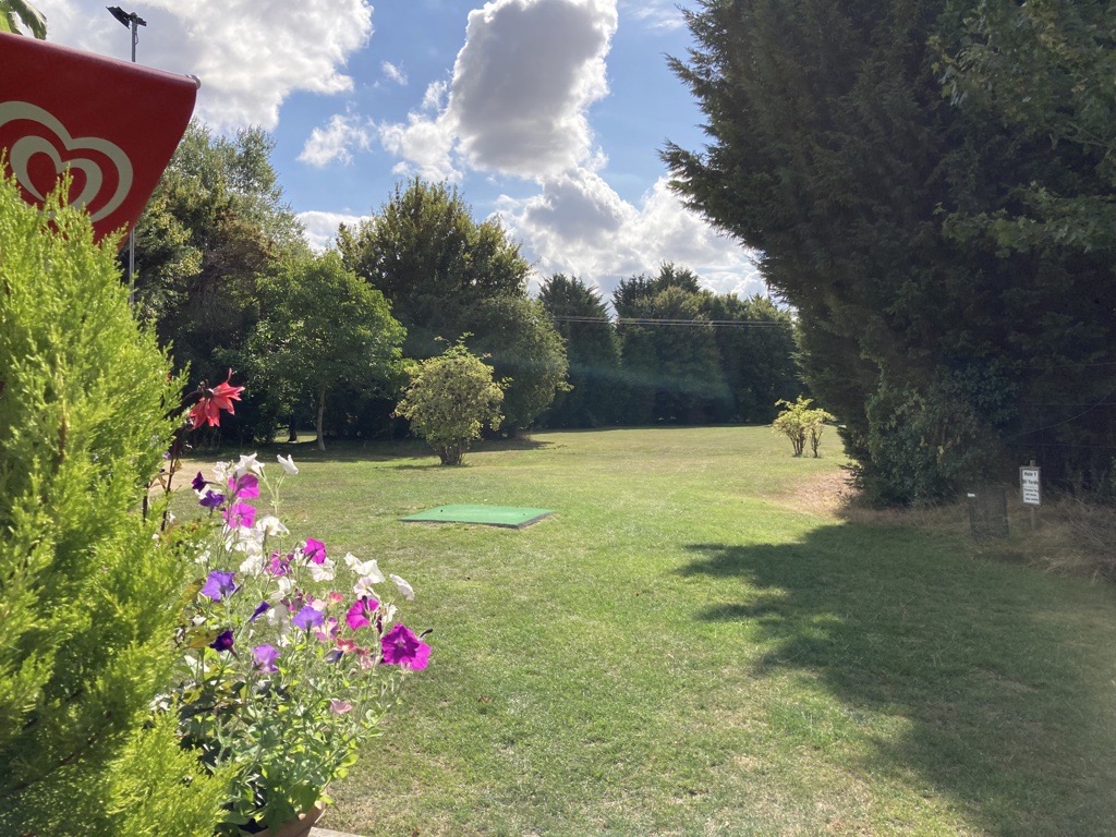 The Club House at Whaddon Golf Centre -Green and flowers