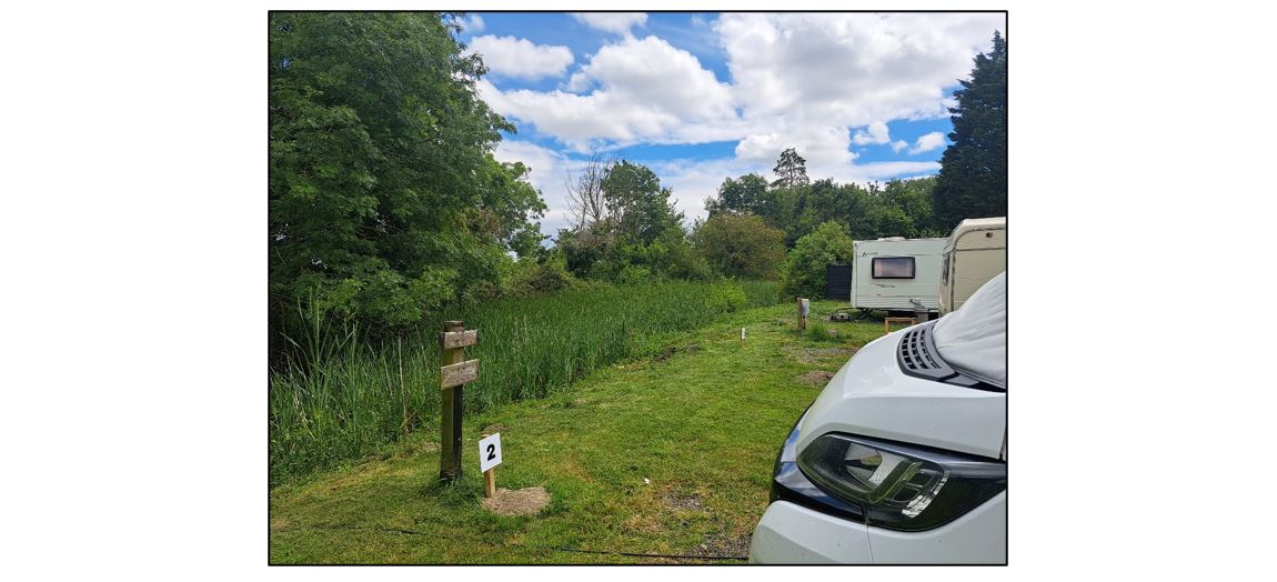 Shepreth Mill Caravan Park - river and vans