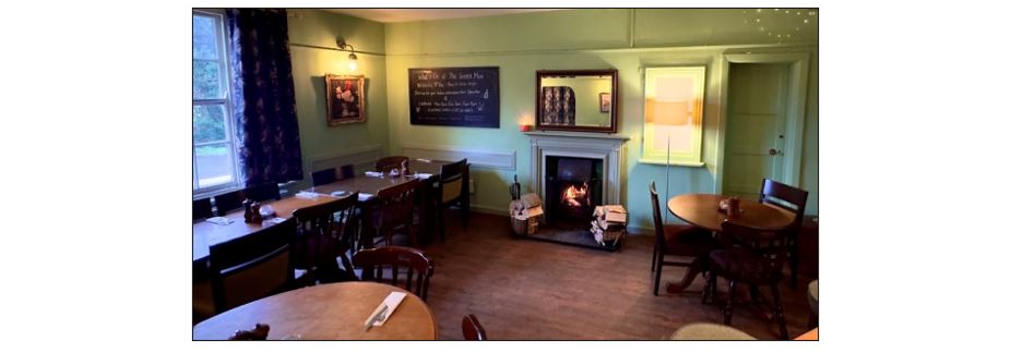 The Green Man - dining area and fire