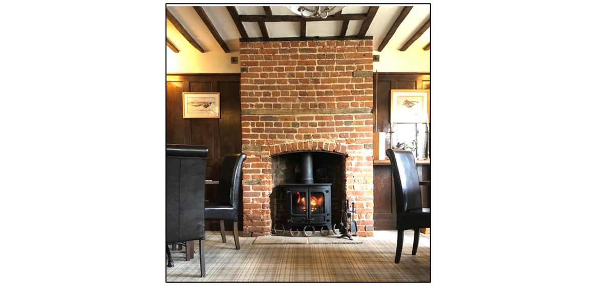The Red House Longstowe, cosy fireplace