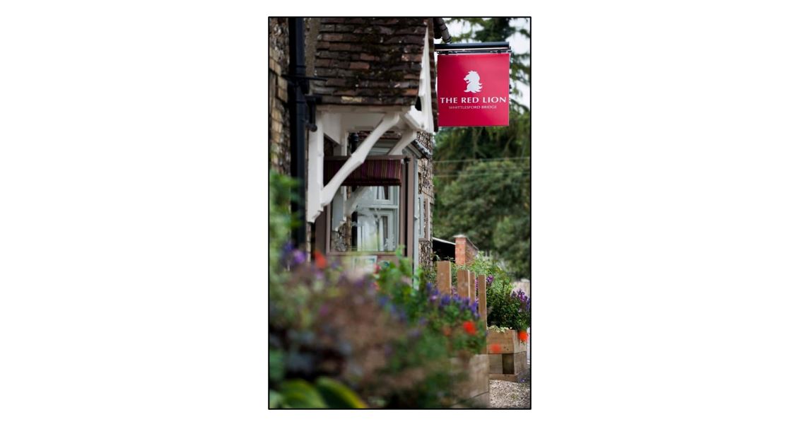 The Red Lion at Whittlesford Bridge - exterior and sign